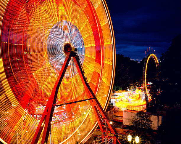 Long exposure of ferris wheel at a carnival stock photo