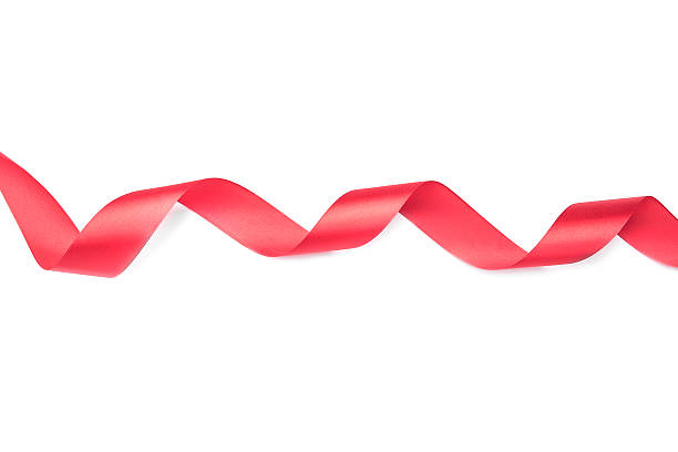 istock Red ribbon spiral on a white background 500458824