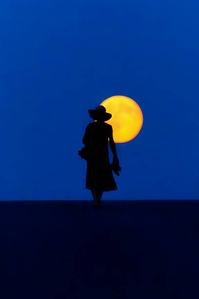 istock Woman walks full moon small 500459400