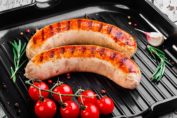 istock chicken sausages on a grill pan 500459571