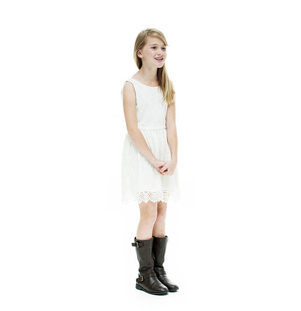 istock Smiling little girl standing and looking away 500459900