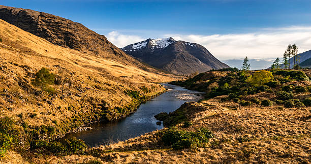 Scottish Mountain and river scene Glen Etive photo is taken looking west along the river etive to Glen Etive and the mountain of Ben Starav. etive river photos stock pictures, royalty-free photos & images