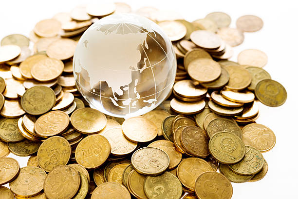 istock Golden coins and globe 500463918