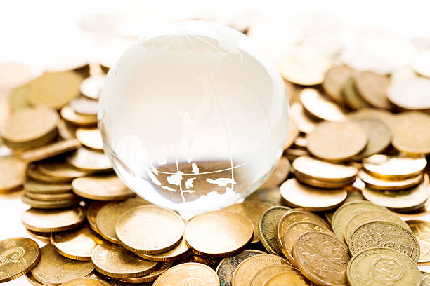 istock Golden coins and globe 500464186