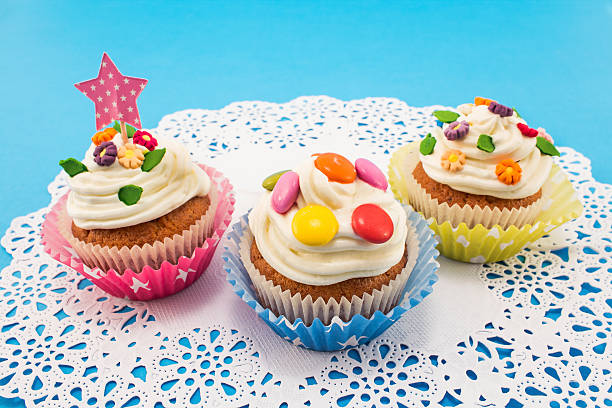 istock Birthday cupcakes on paper  lace 500464422