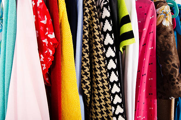 istock Close up on colorful clothes on hangers in a store. 500464748