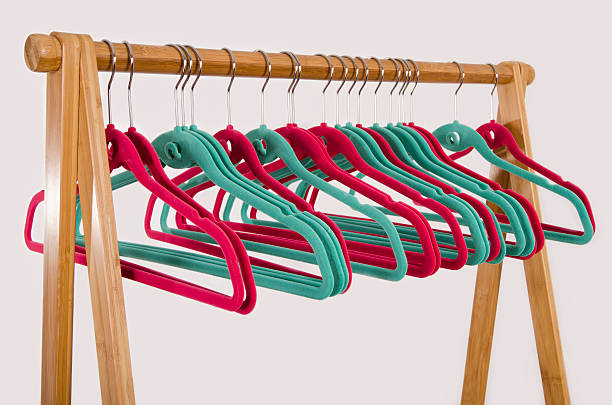 Rack of clothes with empty hangers. stock photo
