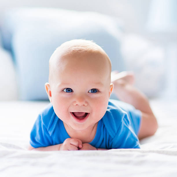 istock Baby boy in white sunny bedroom 500465046