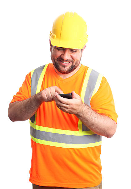 sms operaio edile - construction safety mid adult men road construction foto e immagini stock