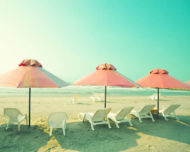 istock Pink Umbrellas in the beach 500473319