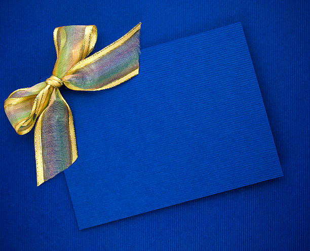 istock Blank blue gift tag tied with a bow 500474389