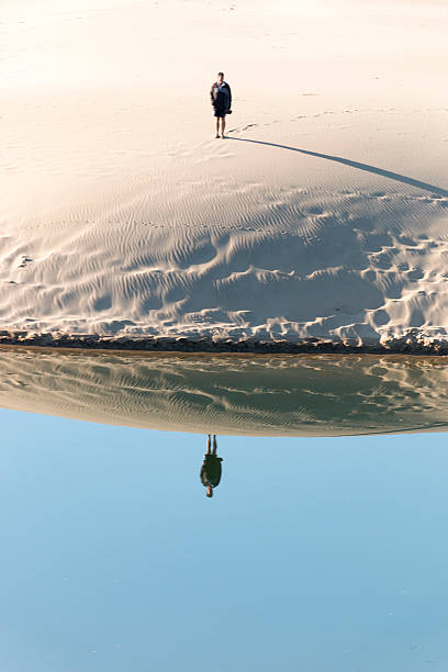 istock Water Refecting Mirror Image Of Man 500476381