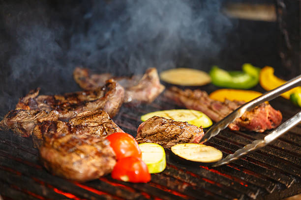 istock Meat are roasted on a grill over coals. 500478480