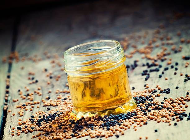 istock Oil of mustard in a small jar 500479154