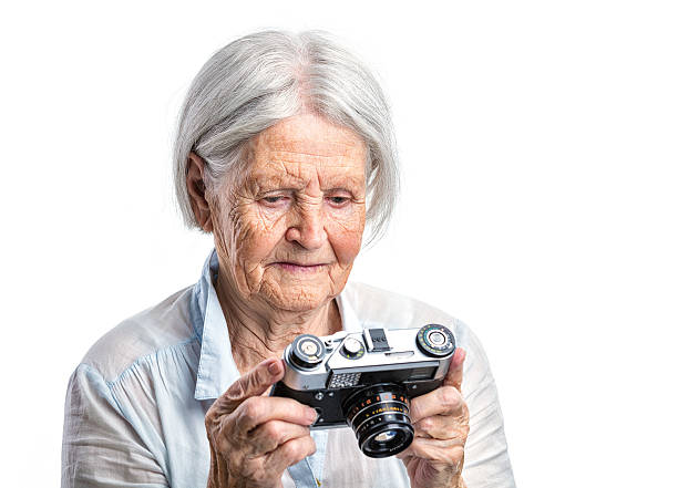 istock Senior woman with retro camera 500479482