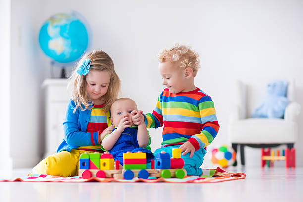 istock Kids playing with wooden toy train 500479826
