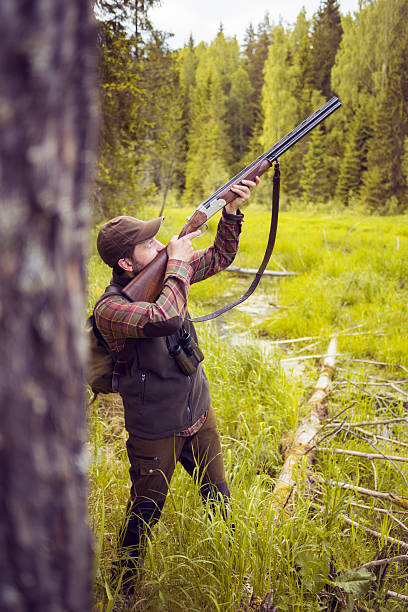 istock Hunting Man Shooting in a Bog 500480192