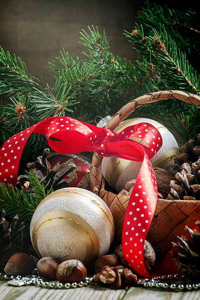 istock Wicker basket with Christmas balls and pine cones 500480292