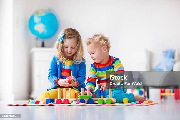 Kids Playing With Wooden Toy Train Stock Photo - Download Image Now - Playing, Toy, Child