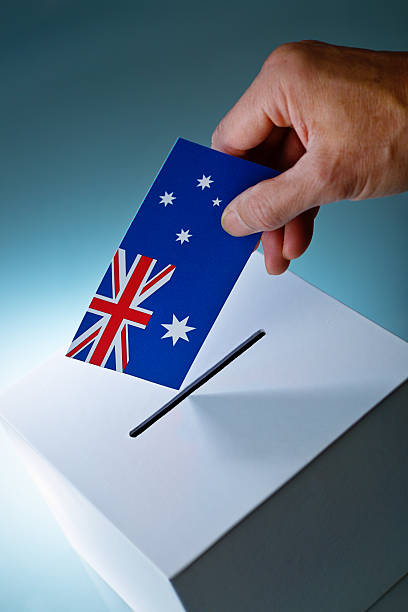 istock Australian Election Voter Voting Ballot Over Ballot Box 500482292