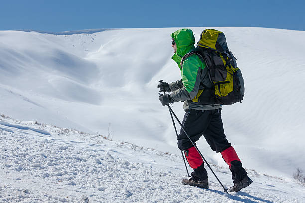 istock Hiker in winter mountains on sunny day 500484866