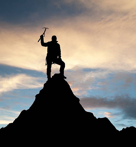 istock man on mountains with ice axe in hand 500485284