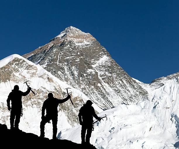 istock Mount Everest and silhouette of climbing men 500485530