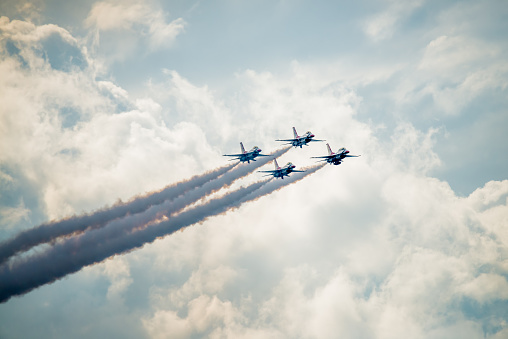 San Antonio, USA - October 31, 2015: United States Air Force F-16 Thunderbirds approaching above the clouds