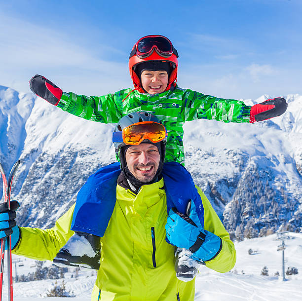 istock Happy family on ski 500489512