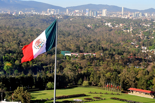 A giant Mexican national flag above Mexico City, Mexico.
