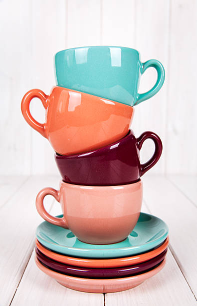 istock Colorful coffee cups on white wooden background 500490214