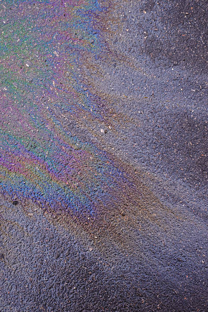 istock Oil dropped on asphalt surface. 500491060