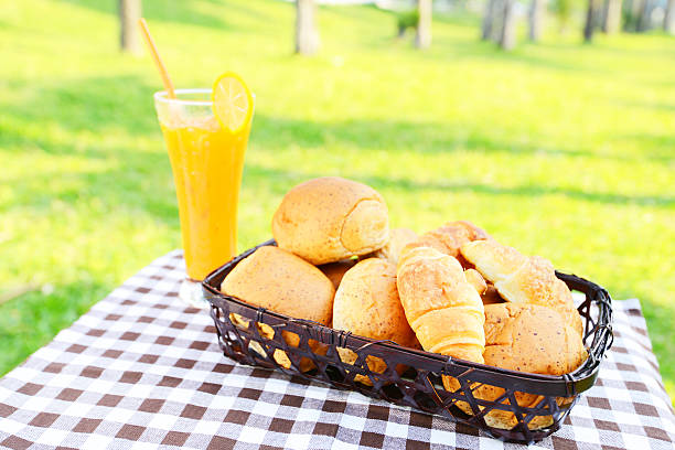 Assorted breads with glass of juice