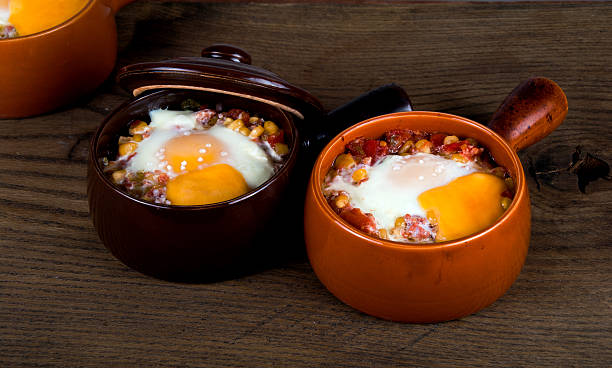istock Eggs baked with creamy sauce, corn, ham, cheese and herbs 500492240