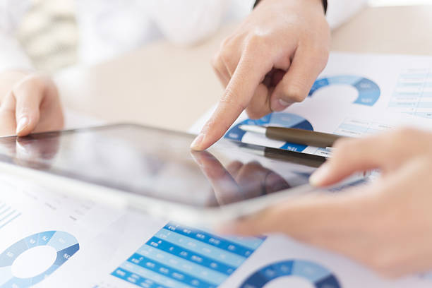 istock Modern people doing business, graphs and charts being demonstrat 500494619