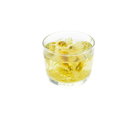 sweet chrysanthemum tea on glass isolatated on white.