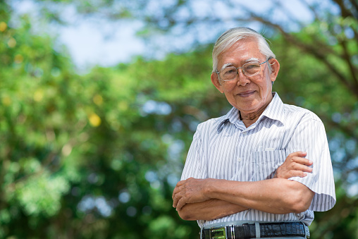 Portrait of smiling aged man looking at camera