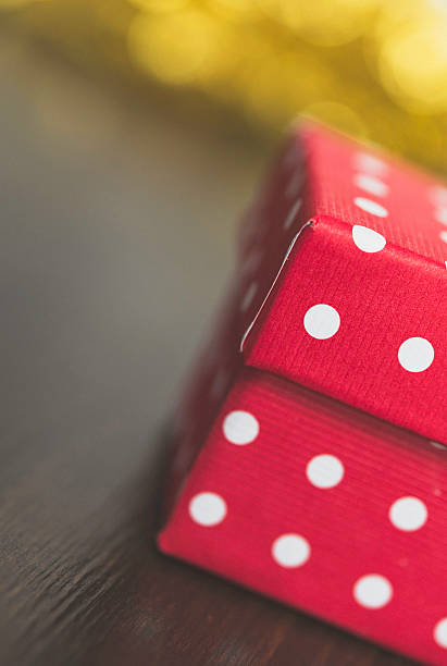 istock Polka dot Christmas gift with gold bokeh 500505954
