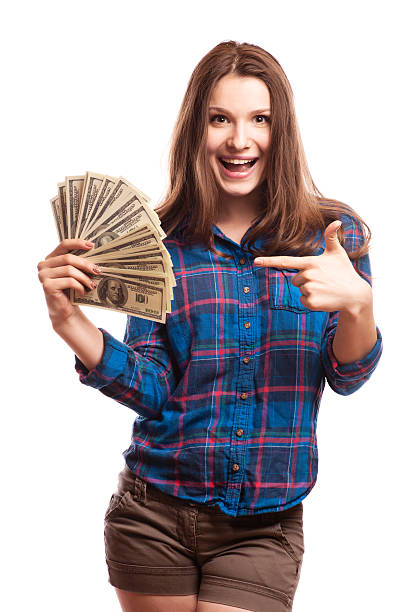 istock young woman with dollars in her hands 500507193