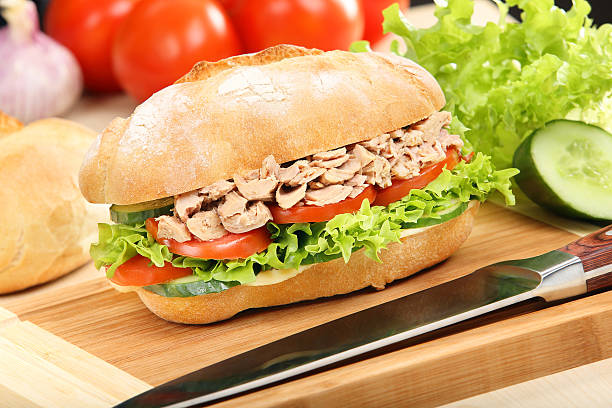 istock Sandwich with tuna and tomato on wood background 500507575