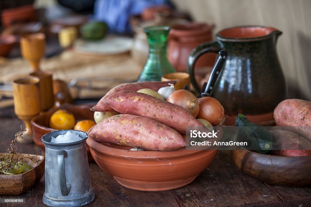 Rustic garden vegetables with old fashioned crockery Old fashioned vegetables in rustic crockery and vintage tableware. Medieval Stock Photo