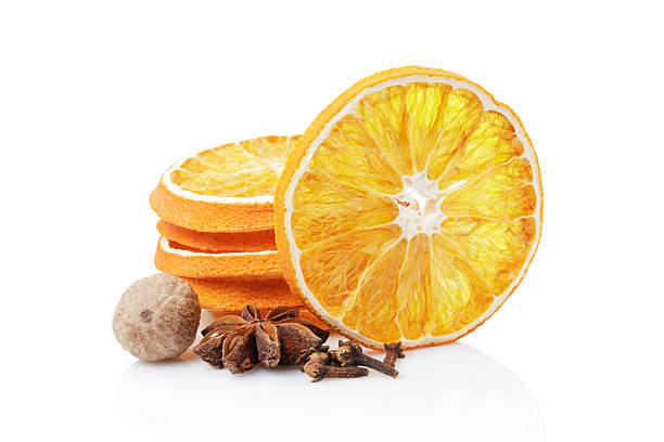 istock Dried orange with spices on a white background 500508486