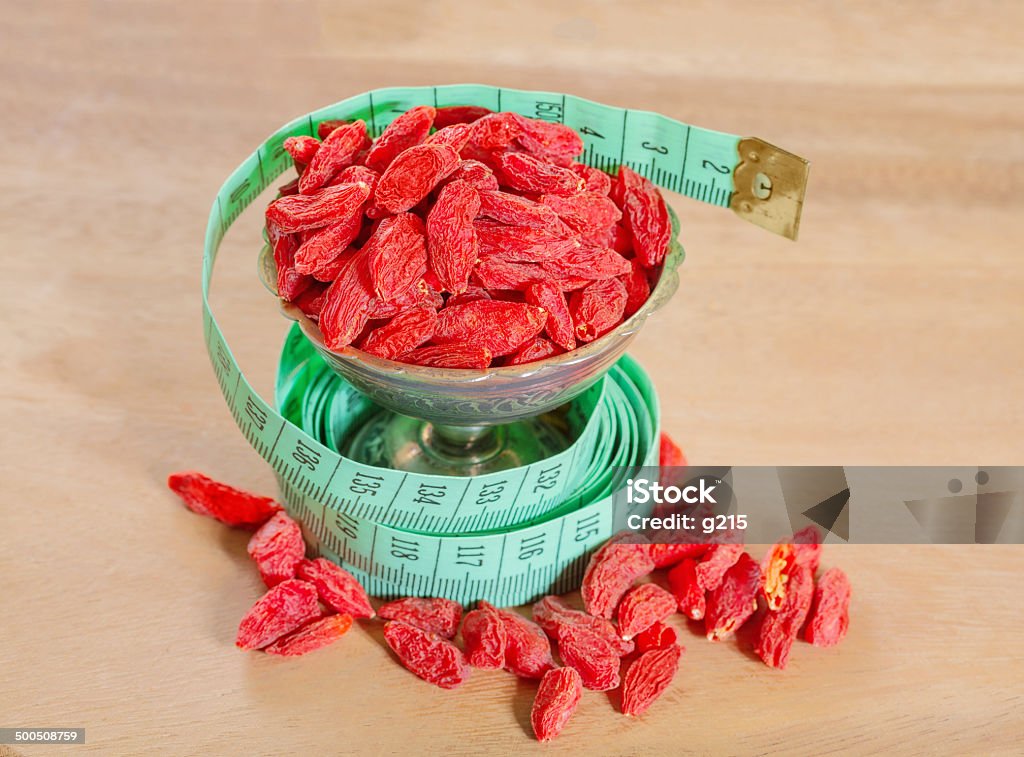 goji berries with a measuring meter Alternative Therapy Stock Photo