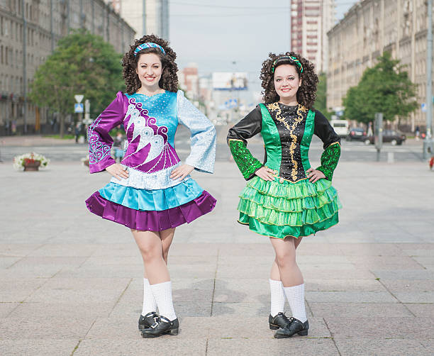 istock Two women in irish dance dresses posing 500511559