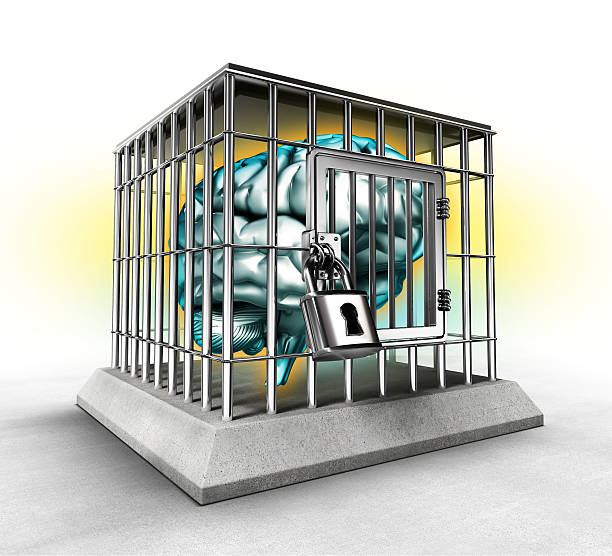 human brain in a cage stock photo