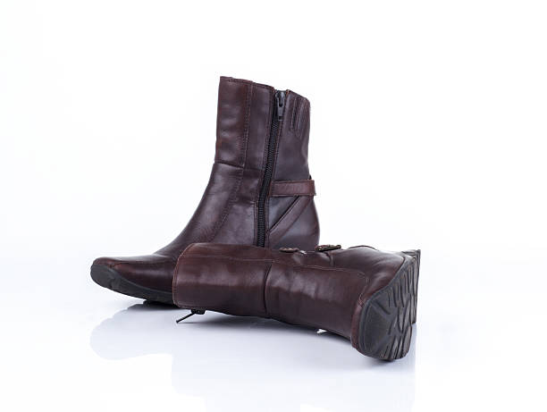pair of leather boots on white background