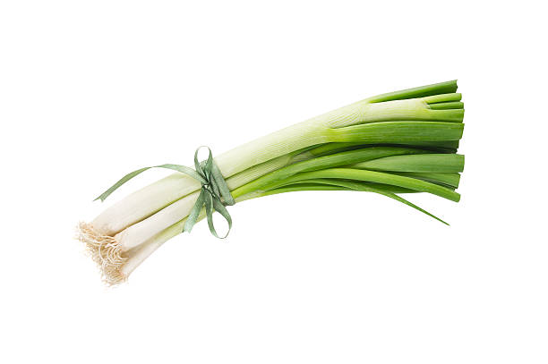istock Green Spring onion tied with  ribbon, isolated 500516456