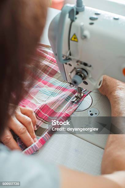Women Sew On Sewing Machine Stock Photo - Download Image Now - 2015, Adult, Adults Only