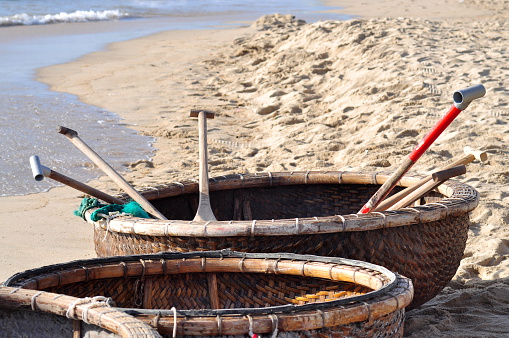 Nha Trang, Vietnam - Jul 14, 2015: Basket boats are waiting on the beach