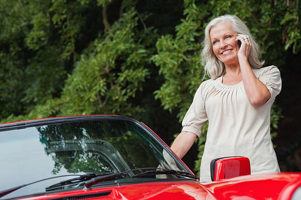 istock Smiling mature woman having phone call 500521175
